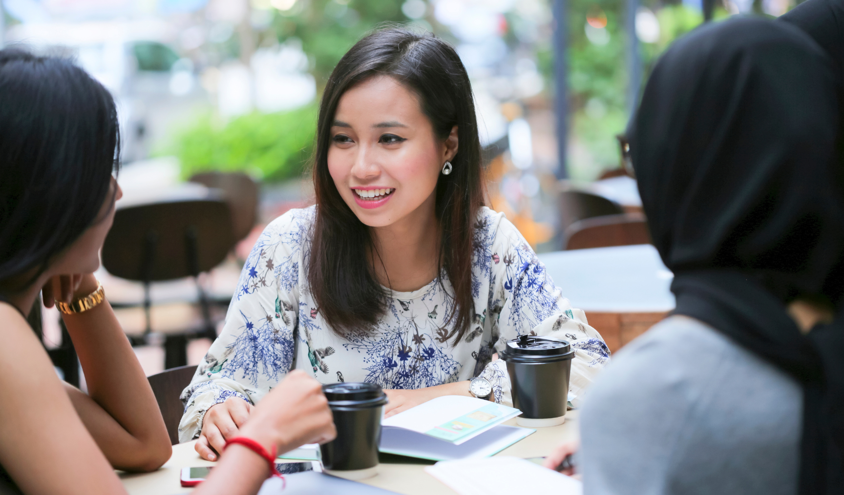 woman chatting with colleagues 