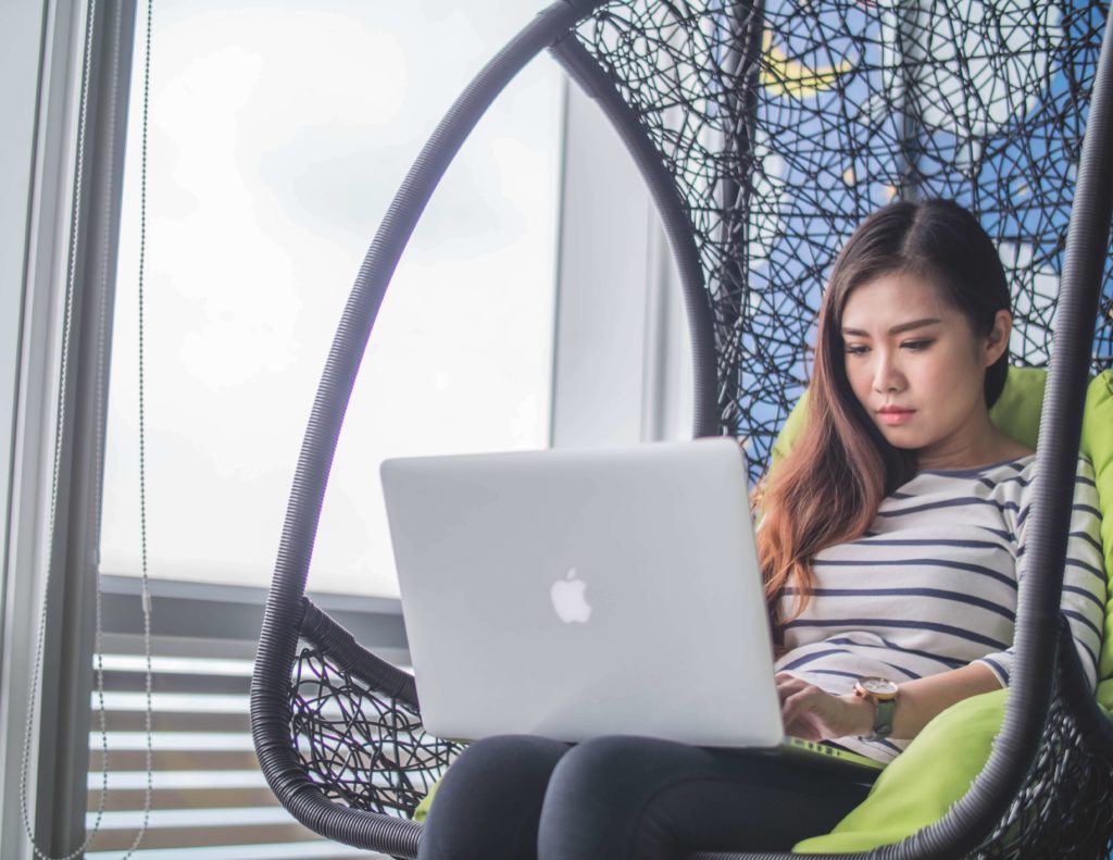 woman reading on her laptop