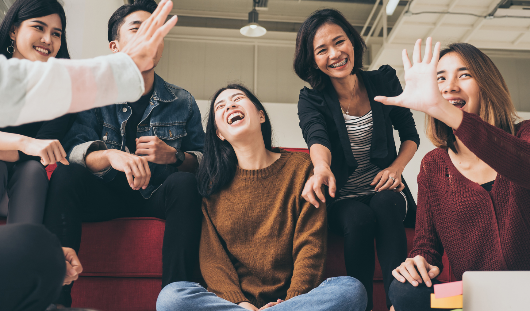 bunch of colleagues talking and laughing together