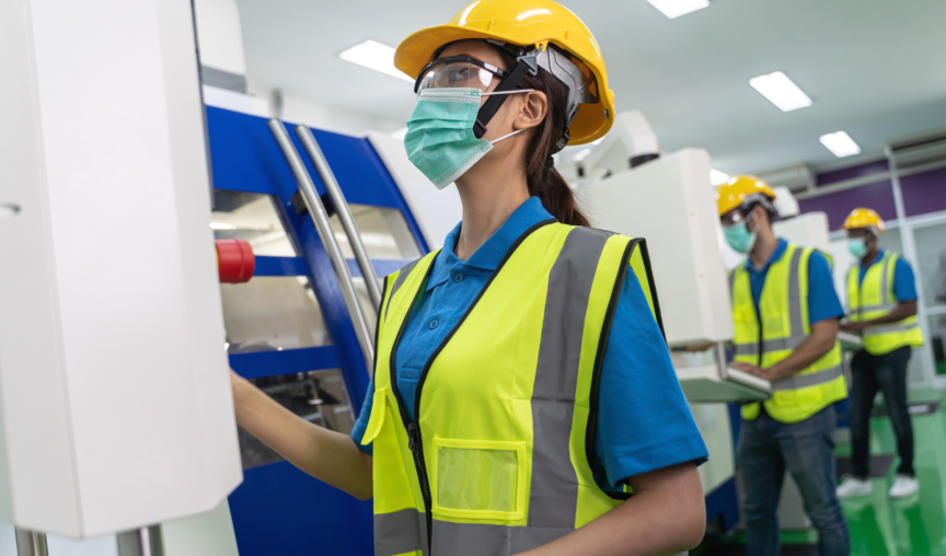 woman in protective gear at her workplace