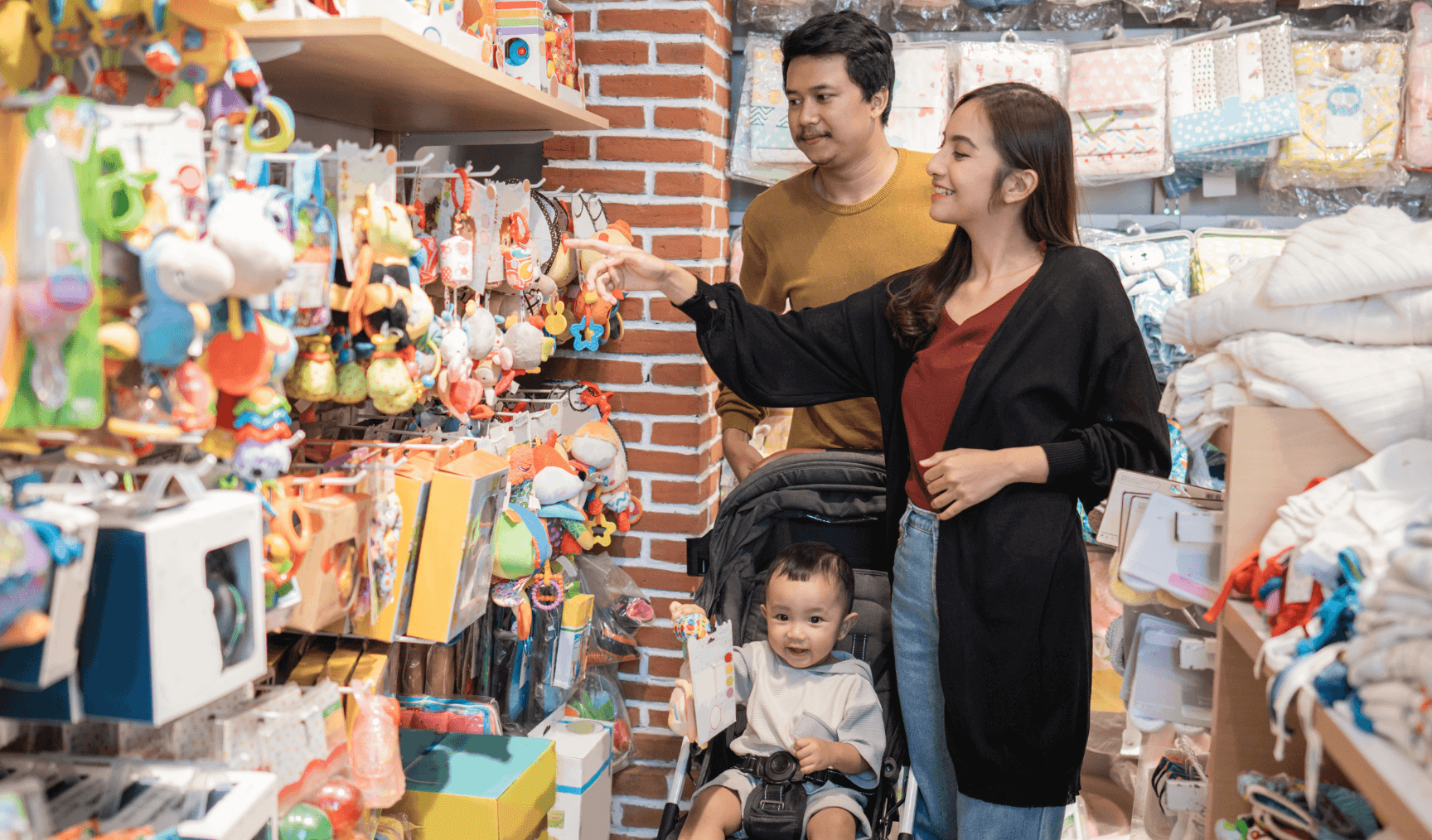 couple shopping in a store while pushing their kid in a pram