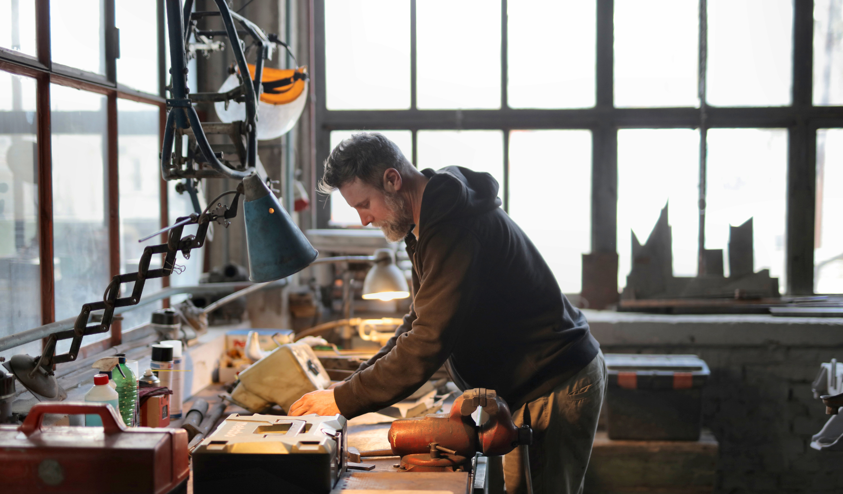 A man works at a welding station