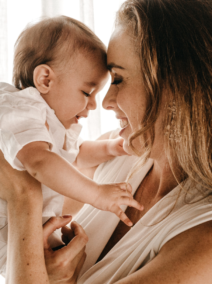 A woman holds a baby