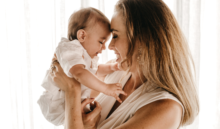 A woman holds a baby