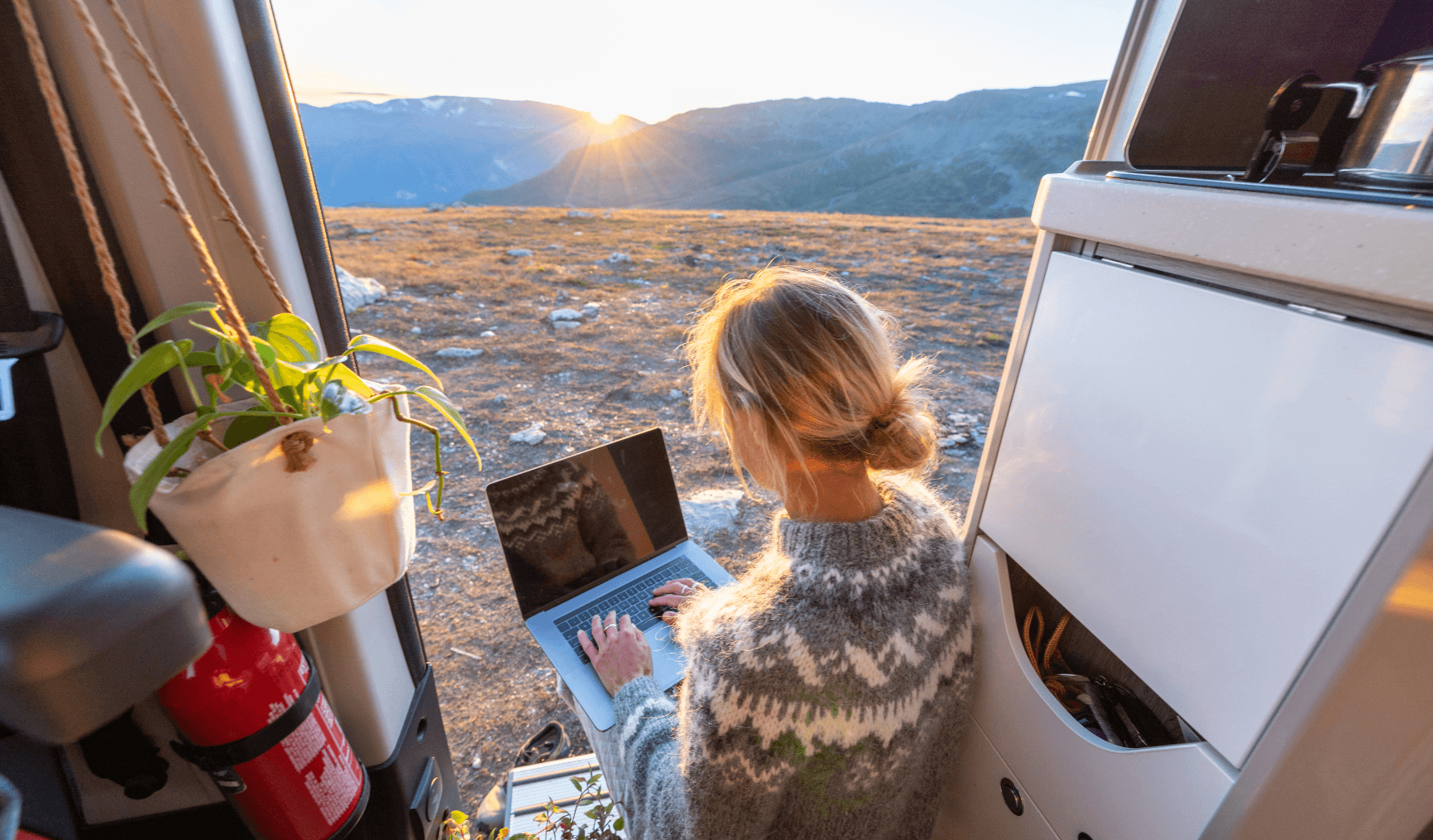 a woman doing remote work at a scenic location