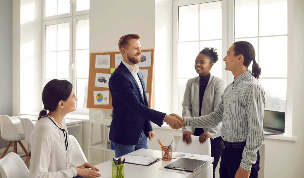 a group of colleagues shaking hands