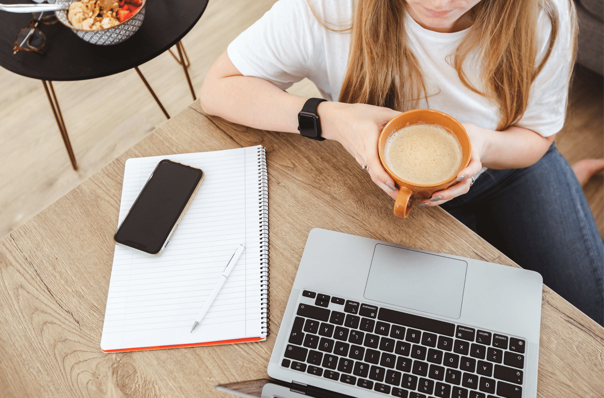 woman sitting at her desk with a coffee - is unpaid work legal