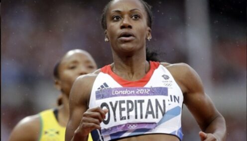 The image shows a female athlete, Abi Oyepitan, competing in a track event during the 2012 London Olympics.