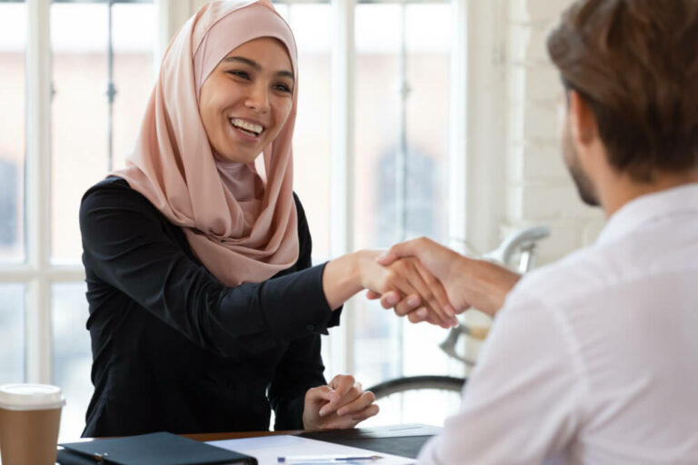 two people shaking hands - the legal requirements of hiring