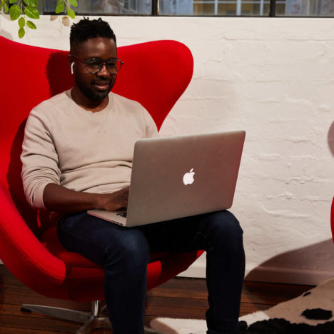 man sending emails on his laptop