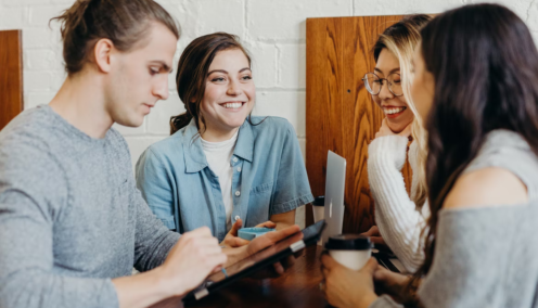 group of people chatting together at a table