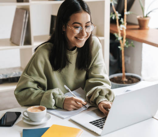 image of a woman at her laptop - Small Business Technology Investment Boost