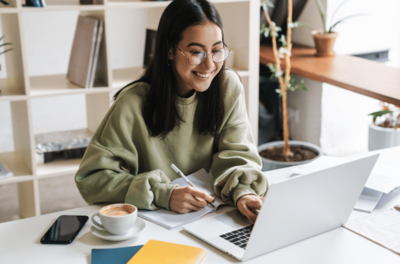 image of a woman at her laptop - Small Business Technology Investment Boost