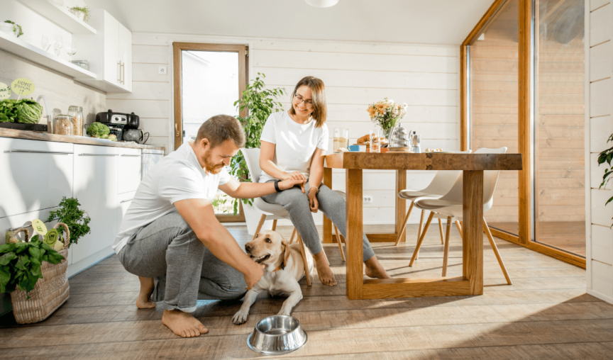 couple and their dog in the kitchen
