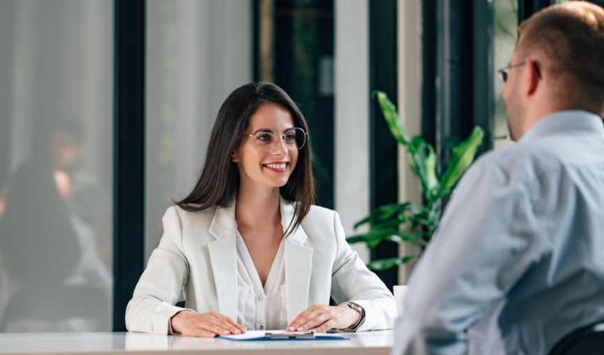 employee having a discussion in the office with her manager