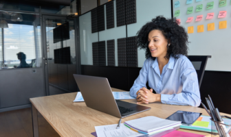 employee speaking to a coworker via video call