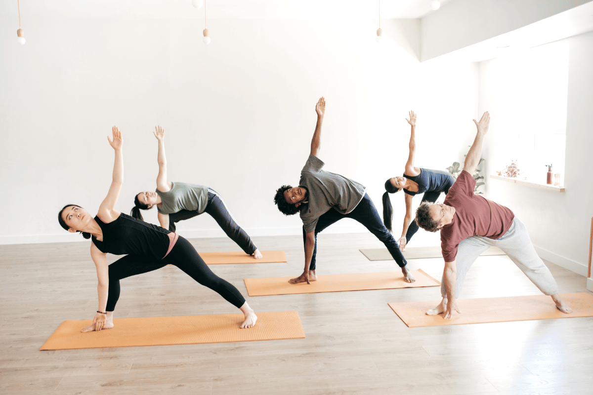 image of people doing yoga at a team building event 