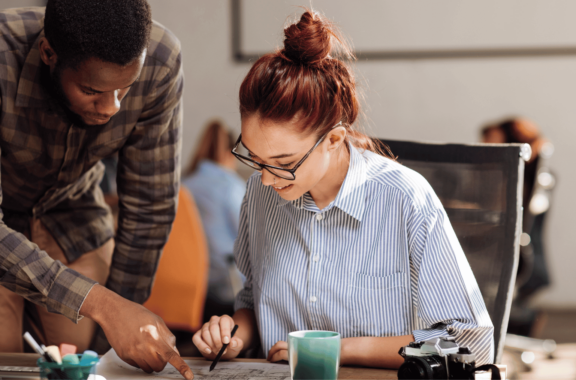 This is an image of 2 people working together.