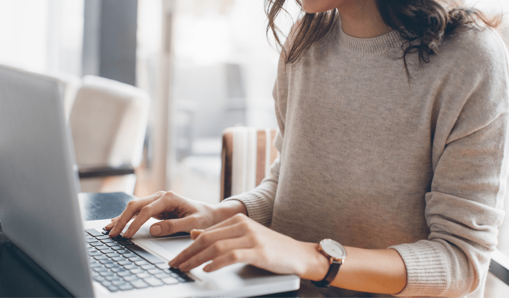 woman typing on her keyboard 