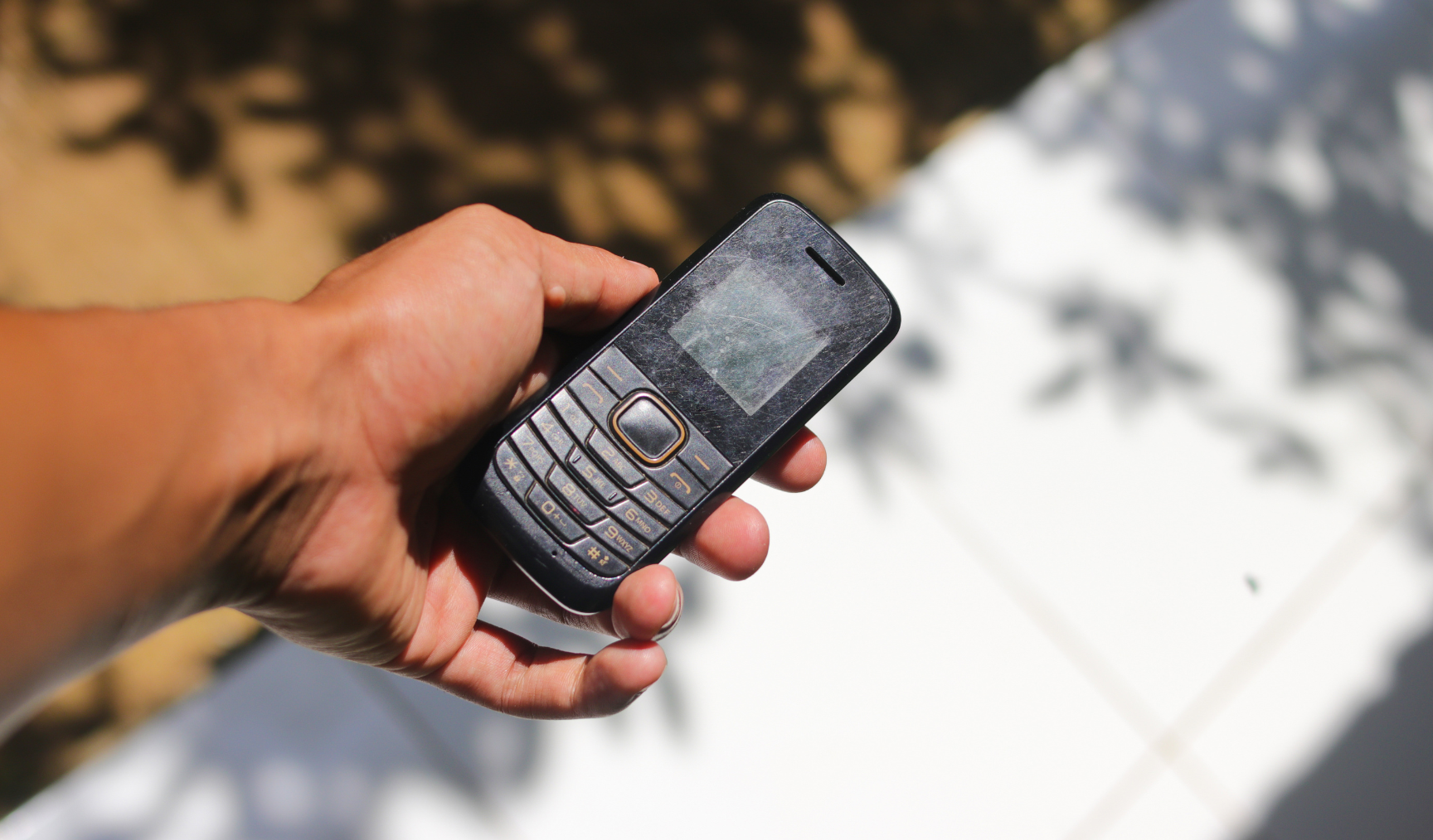 image of person holding an old nokia phone